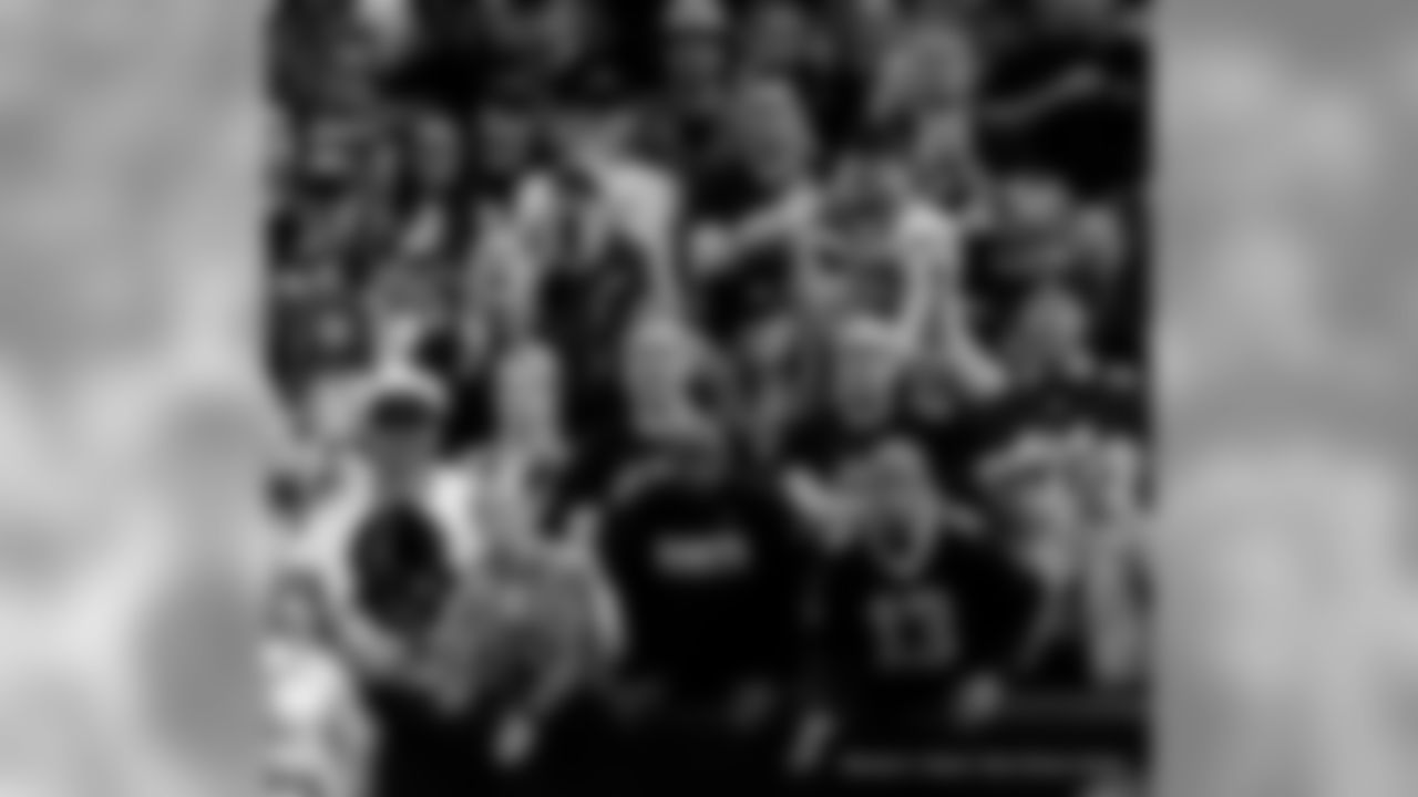 New Orleans Saints fans cheer on the team against the San Francisco 49ers at the Mercedes-Benz Superdome.