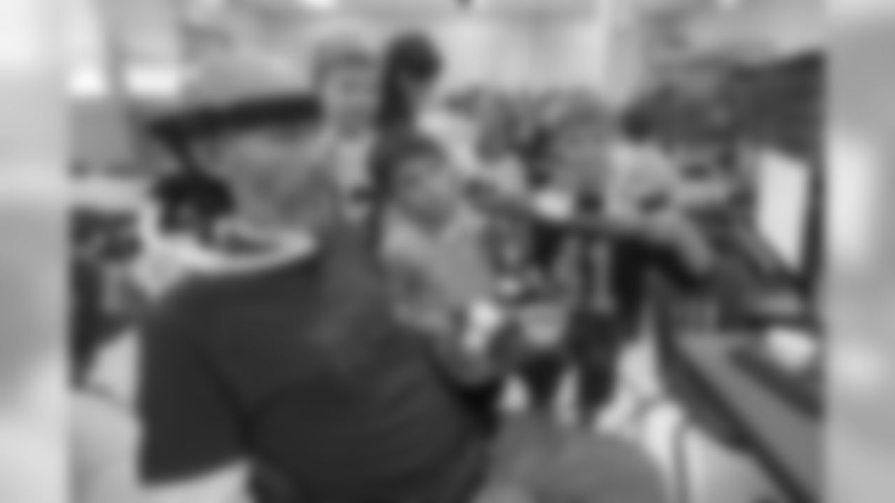 Steve Gleason talks with the children during lunch at Stuart Hall School. Through his computer, Steve said the lunch duty "was one of his most rewarding activities." Steve's 8-year-old son, Rivers, attends there.