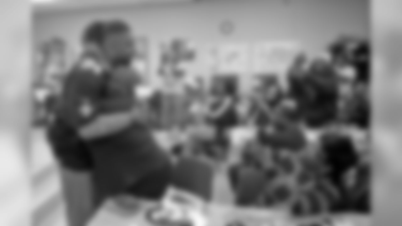 New Orleans Saints defensive end Cameron Jordan visits with students enjoying a Thanksgiving dinner courtesy of the Dudley DuBosier law firm at the Youth Empowerment Project adult education center on Tuesday, November 19, 2019.