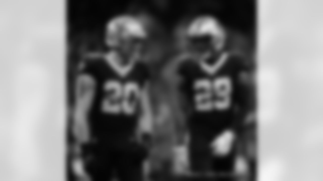 New Orleans Saints linebacker Pete Werner and cornerback Paulson Adebo in action during their 2022 Week 8 game against the Las Vegas Raiders.