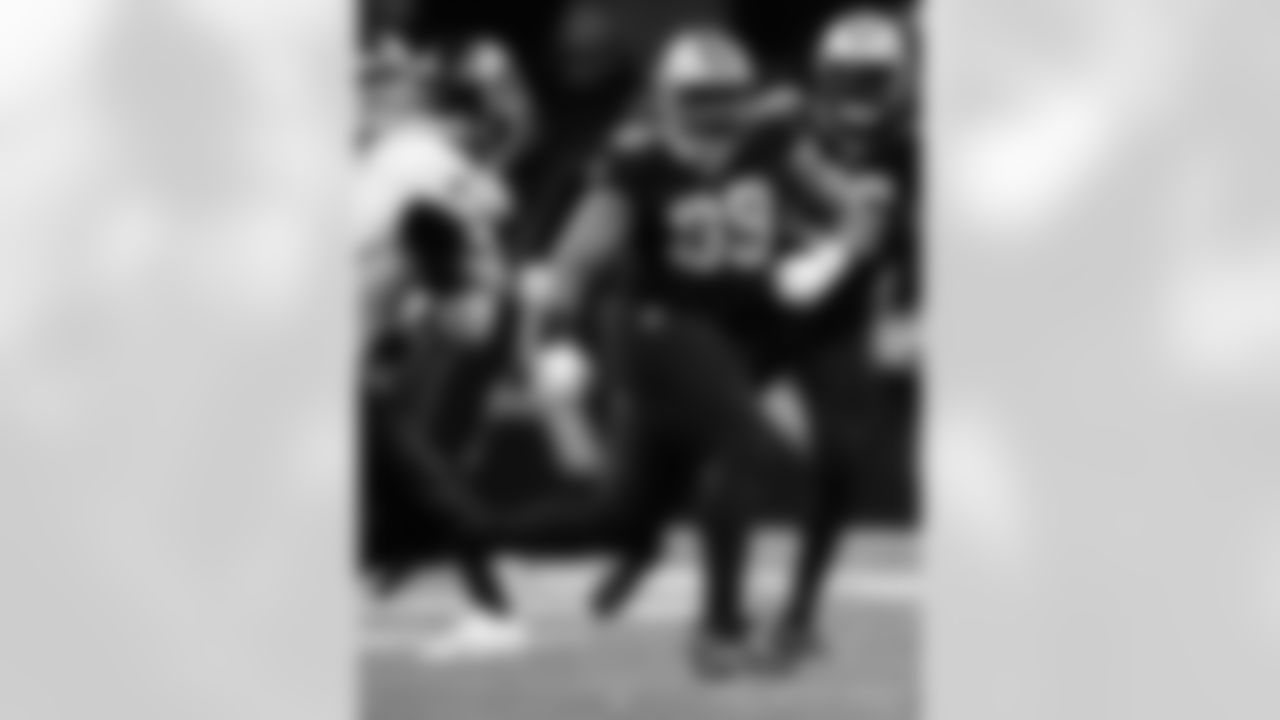 New Orleans Saints players in action during their 2022 Week 15 game against the Atlanta Falcons.