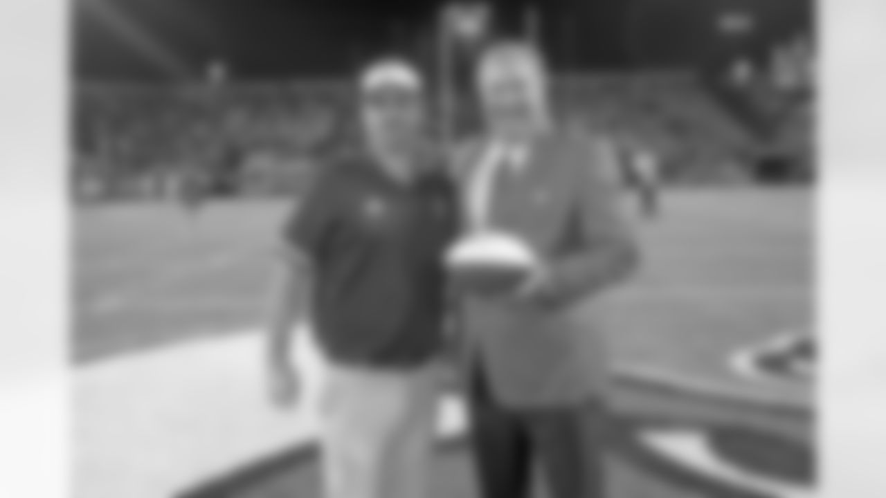 New Orleans Saints owner Gayle Benson and team president Dennis Lauscha presented the game balls during the LHSAA Football Championship Division I game on December 4, 2021. The Catholic-B.R. Bears defeated the Jesuit Football Team 14-10 at Yulman Stadium.