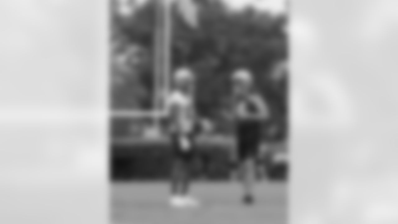 New Orleans Saints quarterback Derek Carr (4) and wide receiver Michael Thomas (13) players participated in the team's 2023 OTA practices on June 6, 2023 at the Ochsner Sports Performance Center.