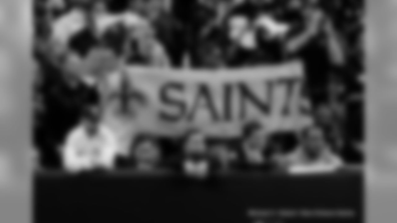 New Orleans Saints fans cheer on the team against the Minnesota Vikings at the Mercedes-Benz Superdome.