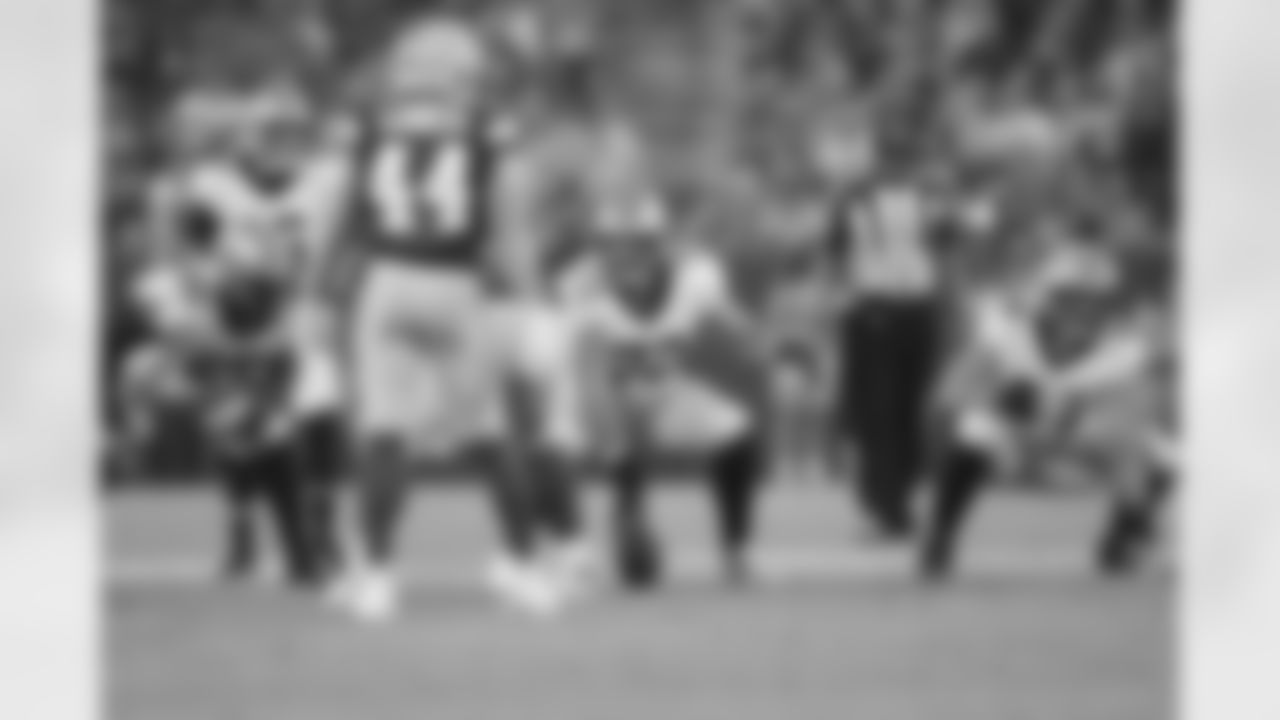 New Orleans Saints players in action during their 2022 Preseason Week 2 game against the Green Bay Packers.