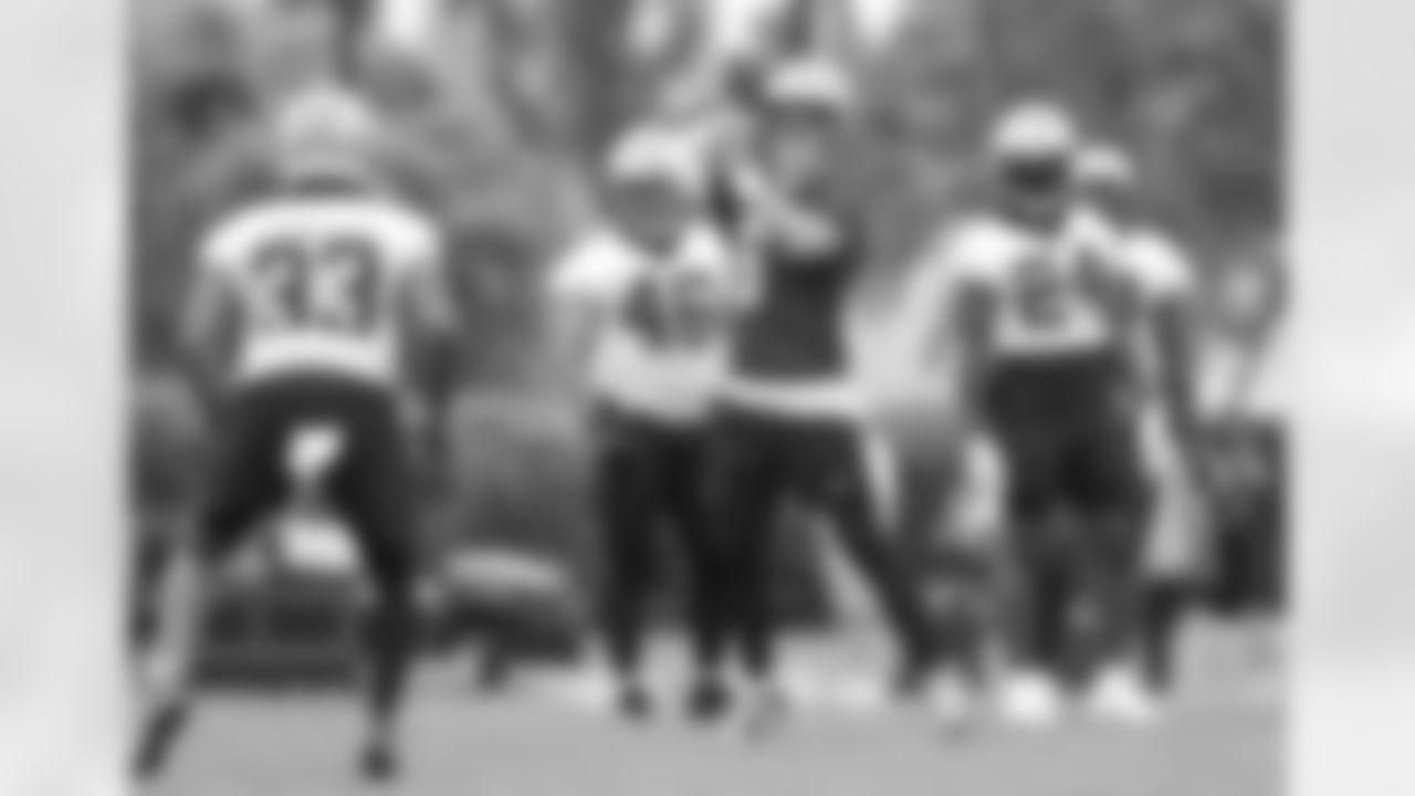 New Orleans Saints quarterback Andy Dalton prepares to throw a pass to running back Abram Smith during the team's 2022 OTA practices on May 26, 2022 at the Ochsner Sports Performance Center.