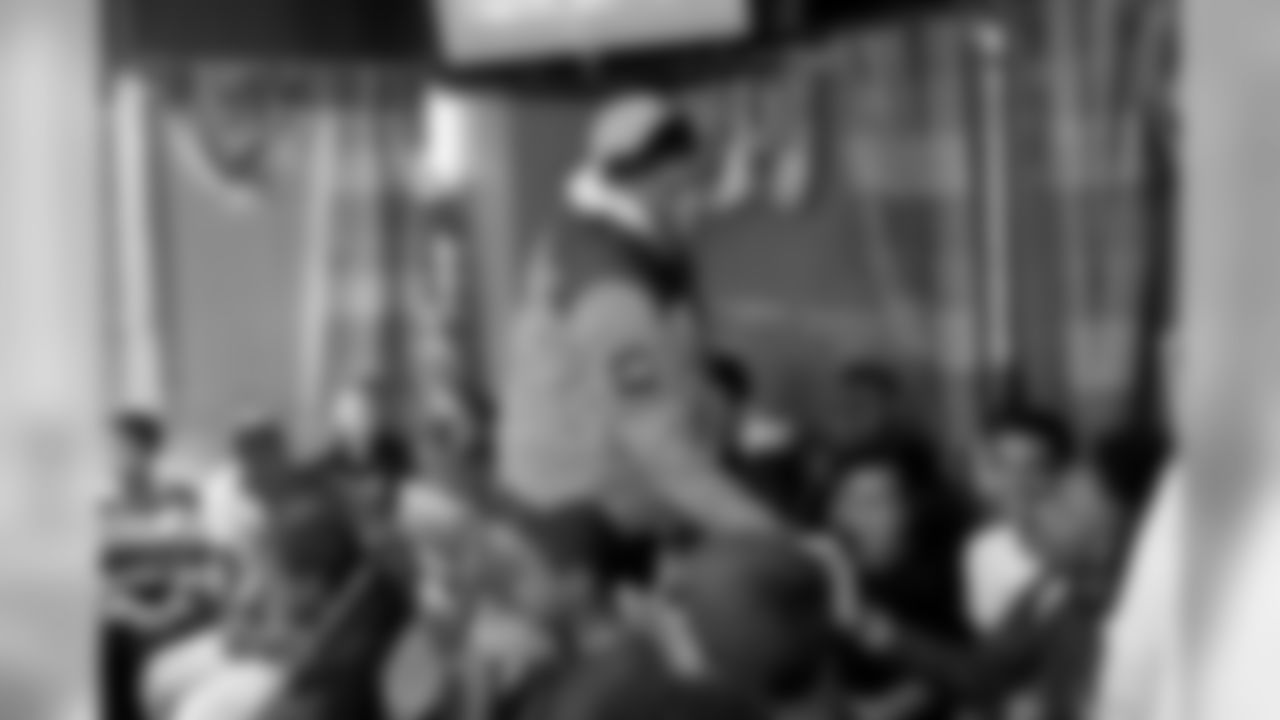 New Orleans Saints wide receiver Michael Thomas provided fresh holiday hair cuts and prize packs to local youth at the Executive Suite Barber Lounge on December 24, 2019.