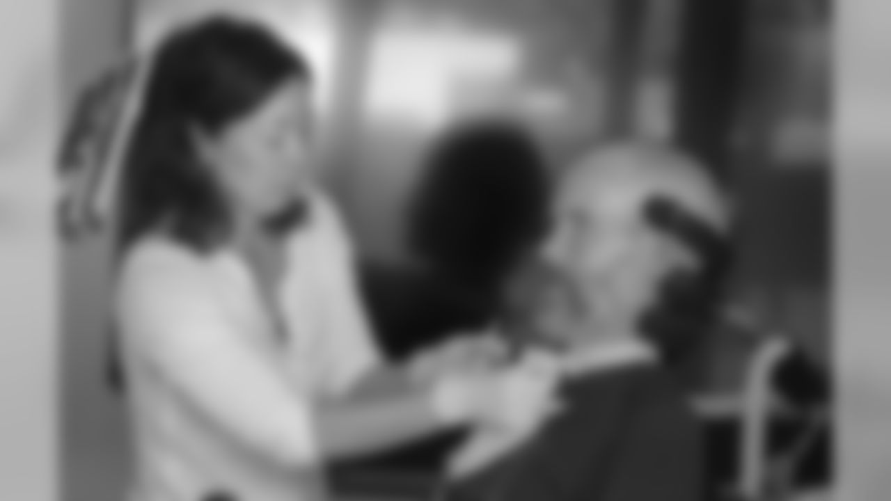 Occupational therapist Jenni Doiron gets Steve Gleason ready for his day.