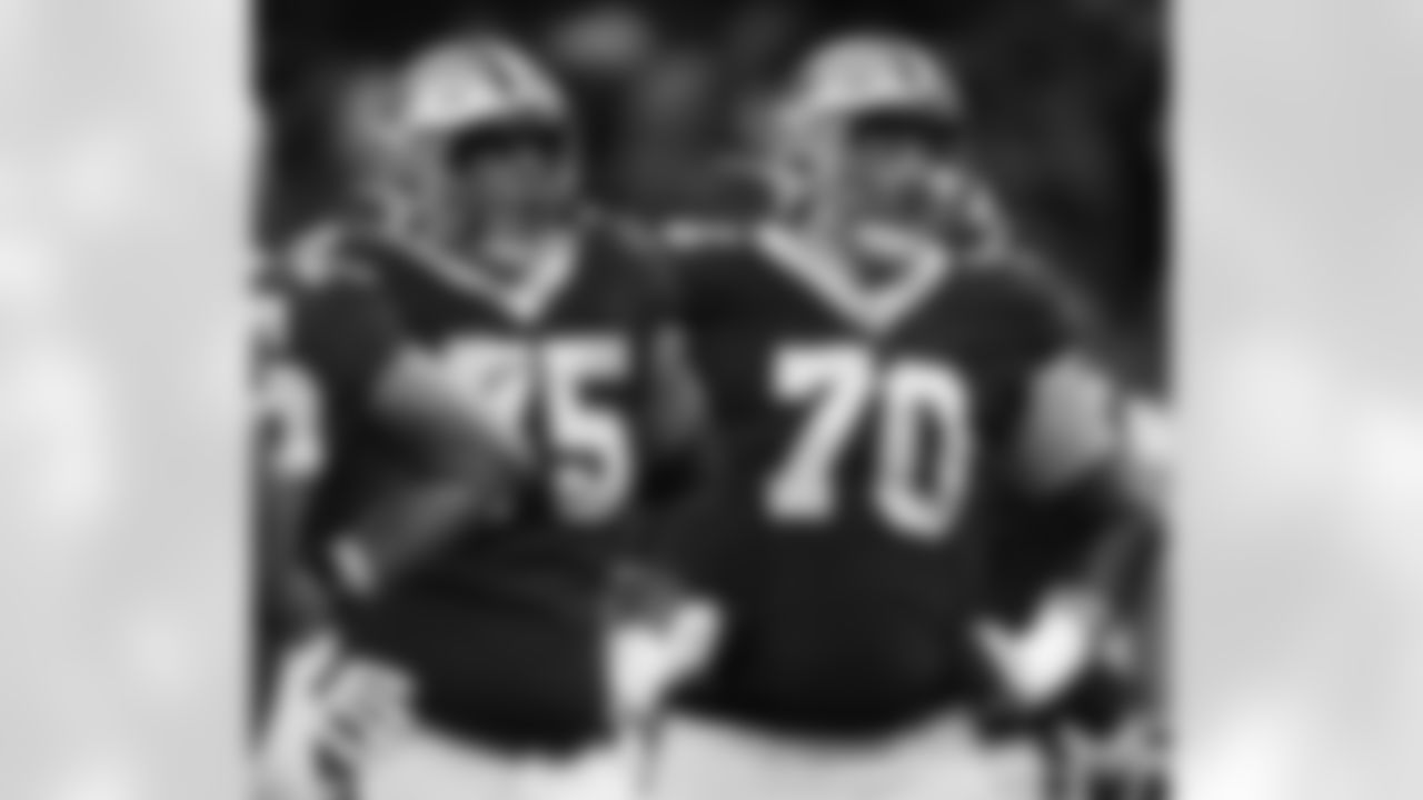 New Orleans Saints offensive linemen Andrus Peat (75) and Trevor Penning (70) in action during their 2022 Preseason Week 3 game against the Los Angeles Chargers.