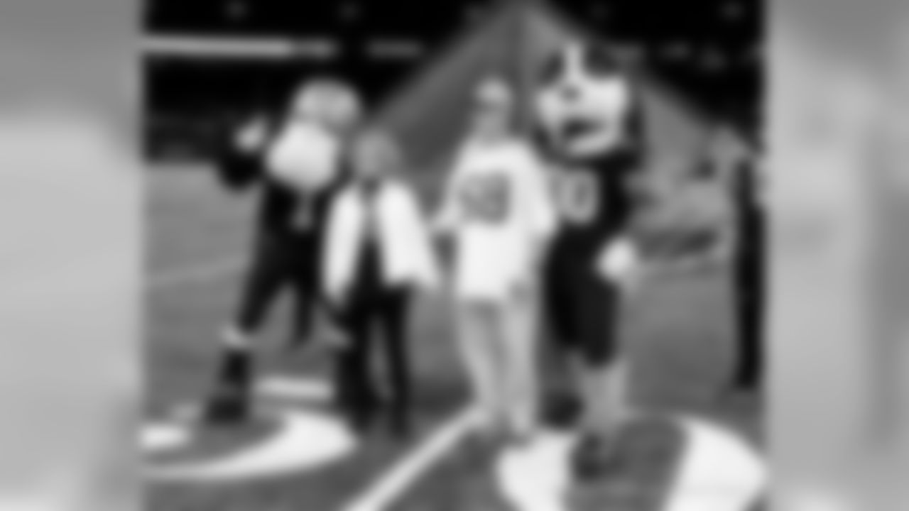 New Orleans Saints fans cheer on the team against the San Francisco 49ers at the Mercedes-Benz Superdome.