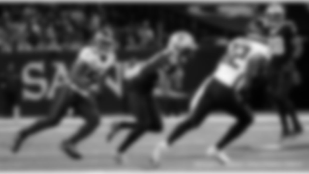 New Orleans Saints players in action during their 2022 Week 15 game against the Atlanta Falcons.