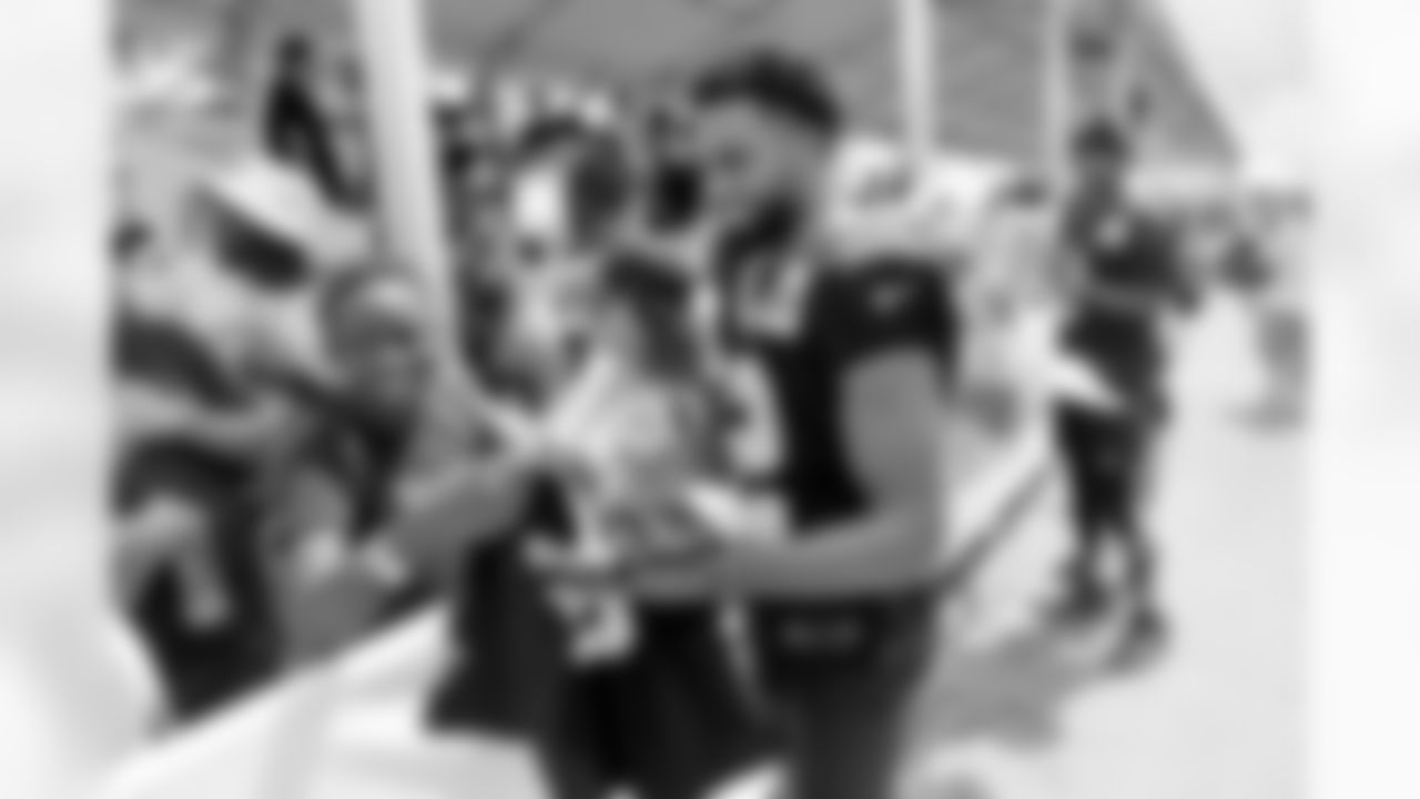 New Orleans Saints wide receiver Chris Olave greets fans at the first open practice of the year at 2022 Saints Training Camp presented by Rouses Markets on Saturday, July 30 at the Ochsner Sports Performance Center.