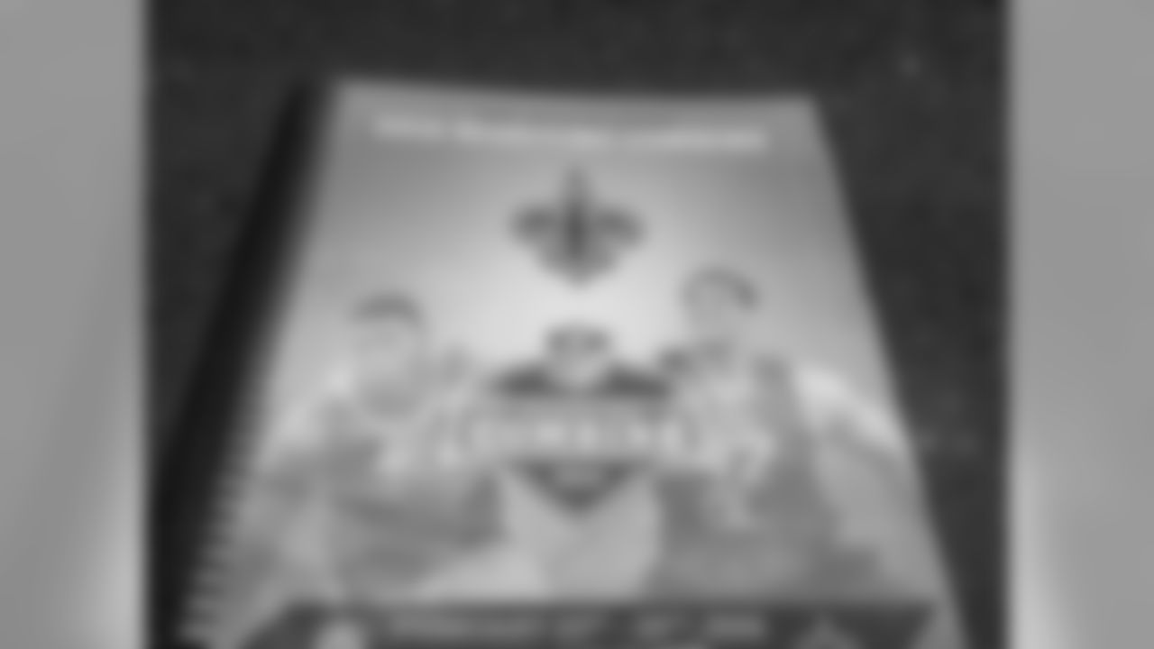 A Saints coaches player bio book sits in the team's suite at the 2016 NFL Combine.