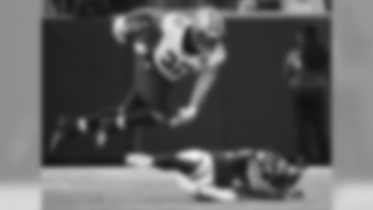 New Orleans Saints running back Jonathan Williams (32) leaps over Atlanta Falcons linebacker Duke Riley (42) during the first half of an NFL football game, Sunday, Sept. 23, 2018, in Atlanta. (AP Photo/David Goldman)