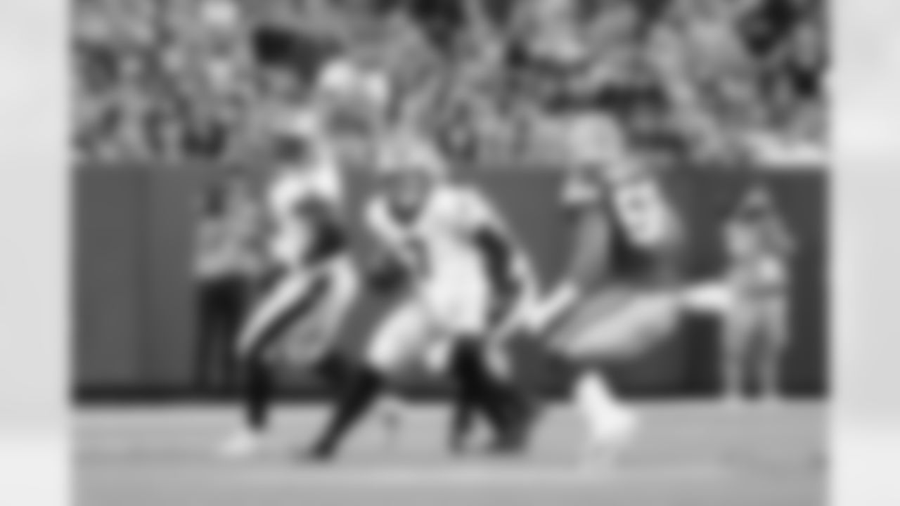 New Orleans Saints players in action during their 2022 Preseason Week 2 game against the Green Bay Packers.