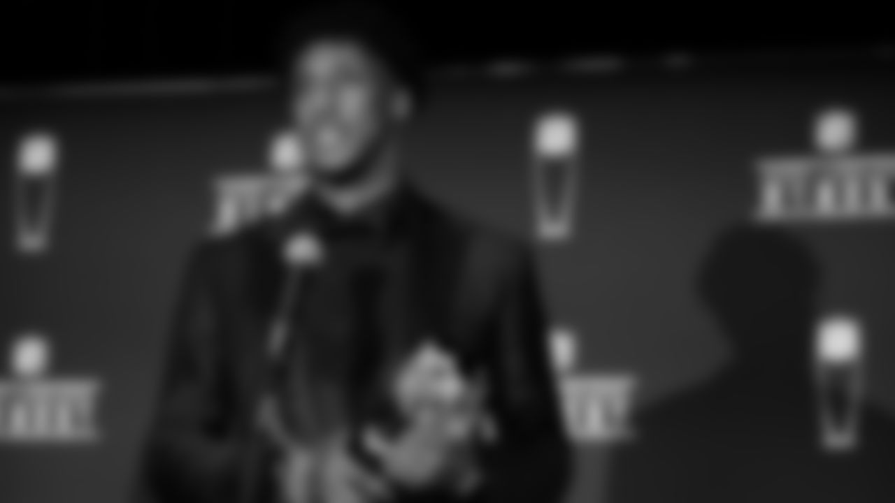 New Orleans Saints quarterback Drew Brees hands out NFL Offensive Player of the Year award to wide receiver Michael Thomas in Miami, Florida.