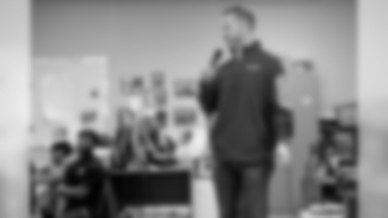 New Orleans Saints defensive end Cameron Jordan visits with students enjoying a Thanksgiving dinner courtesy of the Dudley DuBosier law firm at the Youth Empowerment Project adult education center on Tuesday, November 19, 2019.