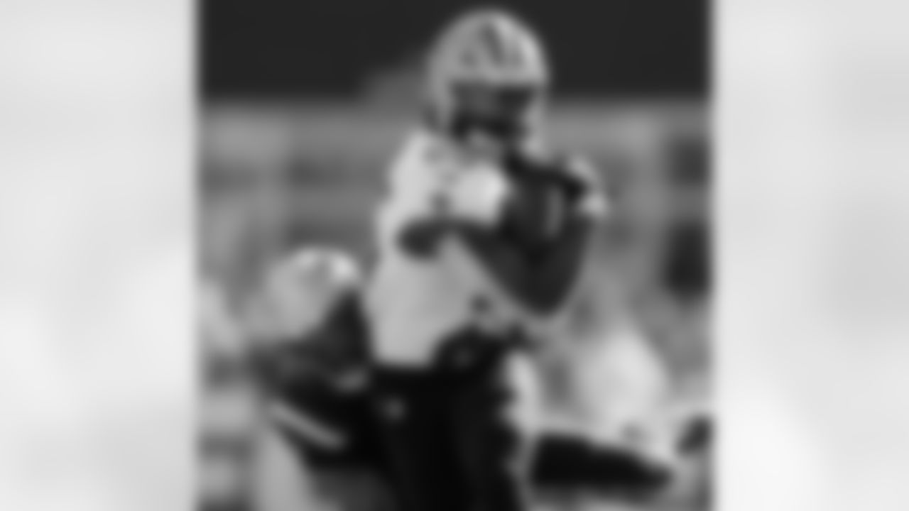 Check out the game action shots from the New Orleans Saints game against the New England Patriots in Week 5 of the 2023 NFL season\ including running back Kendre Miller (25)