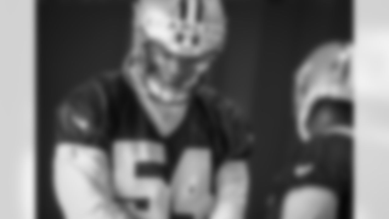 New Orleans Saints defensive end Taco Charlton talks to his teammate during the team's 2022 OTA practices on May 25, 2022 at the Ochsner Sports Performance Center.