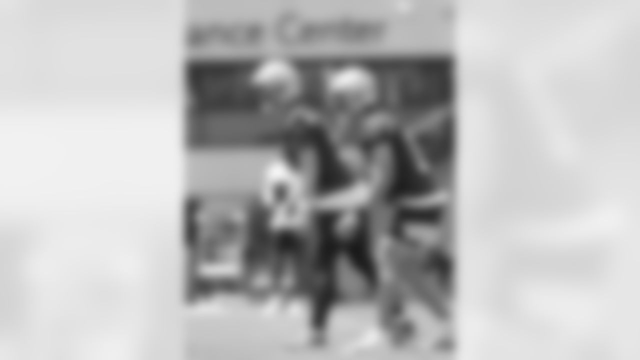 New Orleans Saints quarterbacks Andy Dalton and Ian Book run drills during the team's 2022 OTA practices on May 26, 2022 at the Ochsner Sports Performance Center.