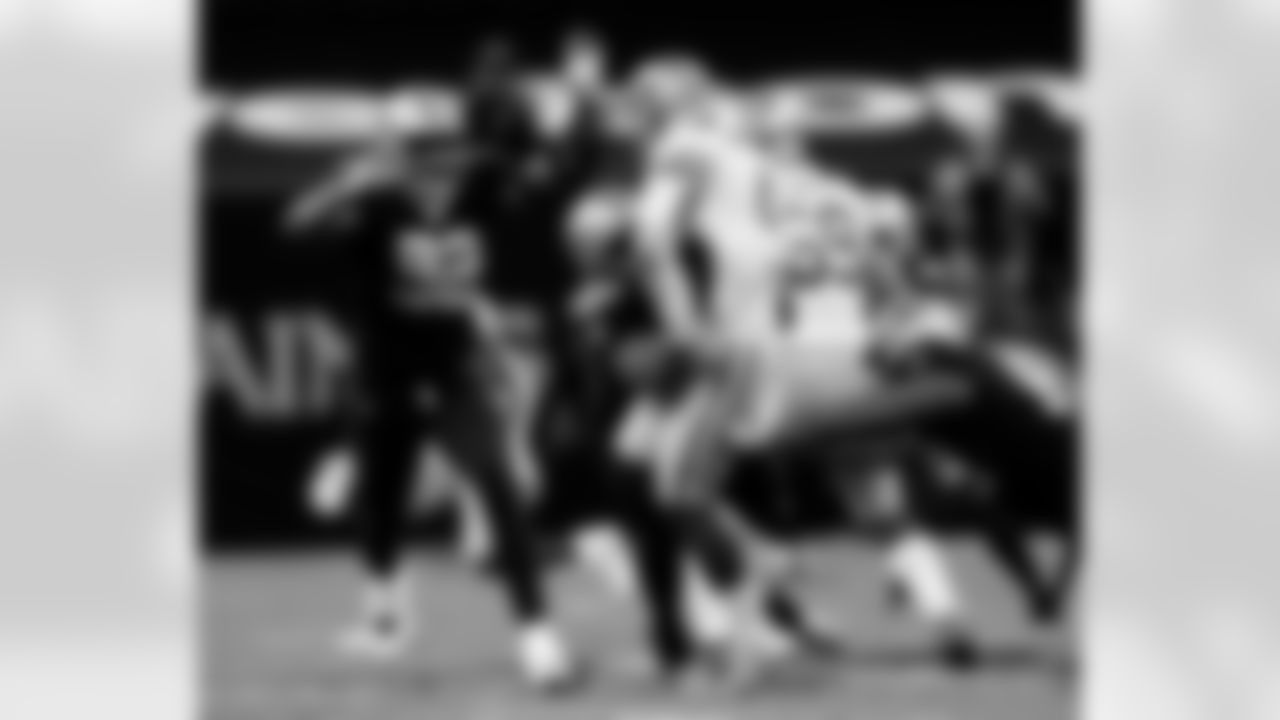 Check out photos of New Orleans Saints defensive end Marcus Davenport in action during the 2020 NFL season.