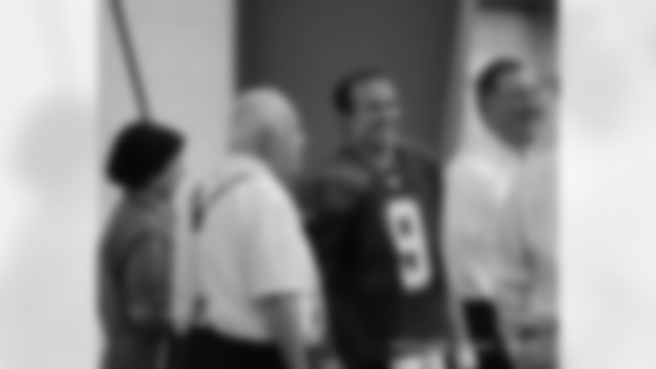 QB Drew Brees chatting with Mr. and Mrs. Benson