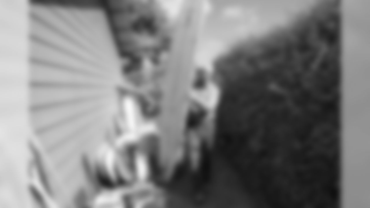 Keith Unger, father of New Orleans Saints center Max Unger, pulls his son's surfboard out of the garage at the McCandless Ranch, Wed, Jan. 16, 2019, in Hookena, Hawaii. NFL football center Max Unger grew up on his family's McCandless Ranch, a 7000 acre working cattle ranch that starts on the slopes of Mauna Loa stretches down to Hookena Beach. (Marco Garcia for the New Orleans Saints)