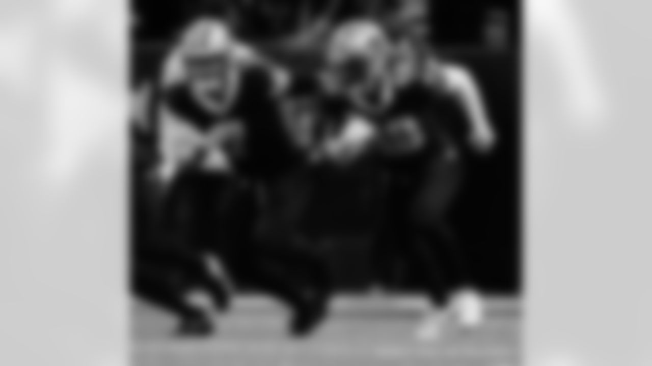 New Orleans Saints players in action during their 2022 Week 15 game against the Atlanta Falcons.