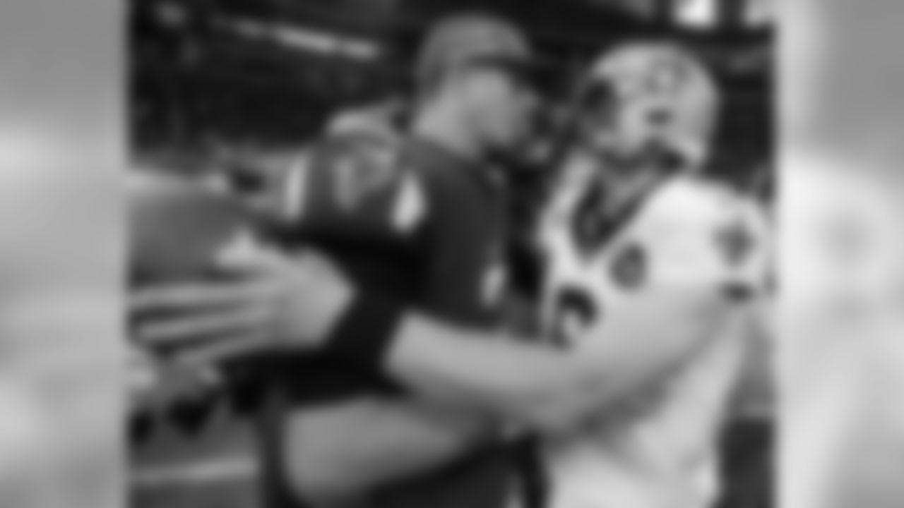 Atlanta Falcons quarterback Matt Ryan (2) speaks with New Orleans Saints quarterback Drew Brees (9) after overtime of an NFL football game, Sunday, Sept. 23, 2018, in Atlanta. The New Orleans Saints won 43-37. (AP Photo/David Goldman)