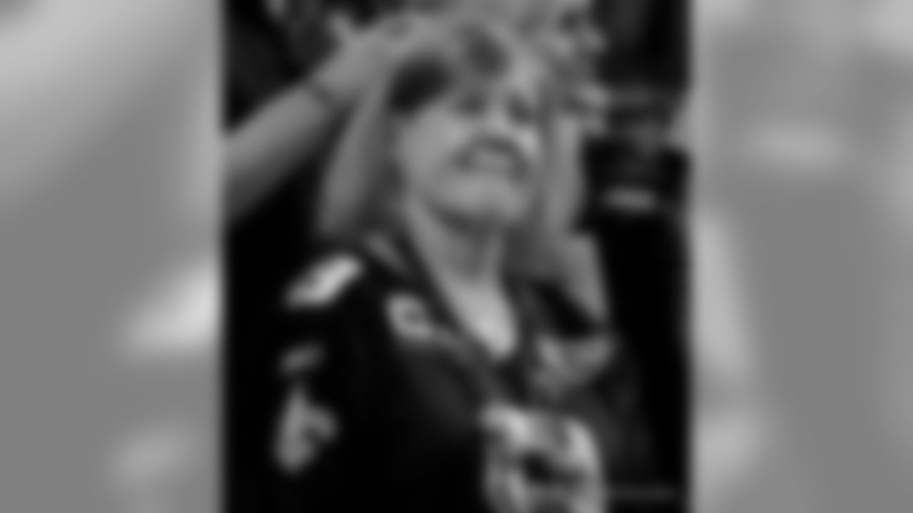 New Orleans Saints fans cheer on the team against the Minnesota Vikings at the Mercedes-Benz Superdome.