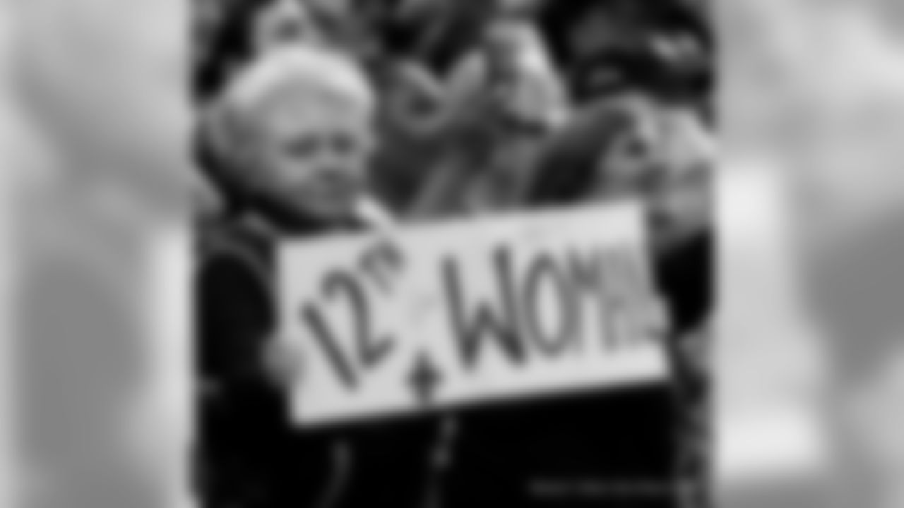 New Orleans Saints fans cheer on the team against the Minnesota Vikings at the Mercedes-Benz Superdome.
