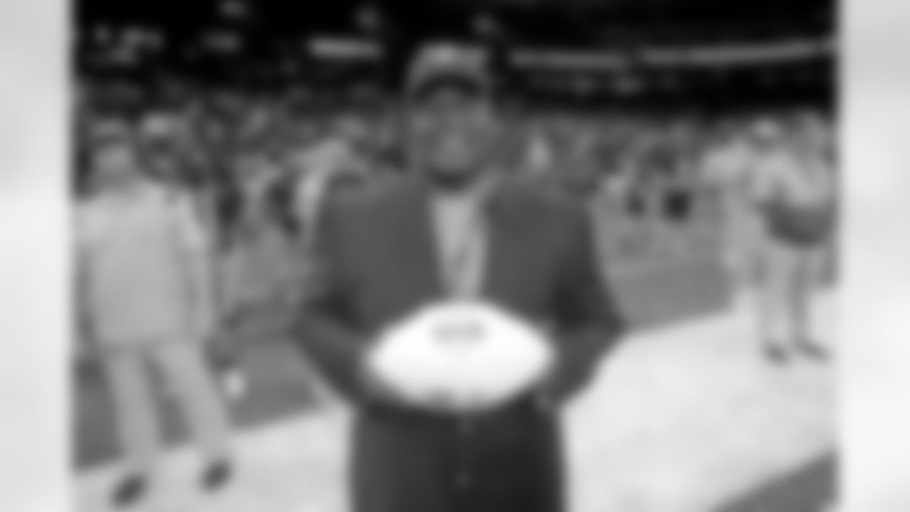 Saints legend Tyrone Hughes presented game balls to Westgate Tigers head coach Ryan Antoine and Warren Easton Fighting Eagles head coach Jerry Phillips before the Class 4A State Championship game on Friday, December 10, 2021. Hughes and Saints staff also presented game balls during Saturday's championship games at the Caesar's Superdome.