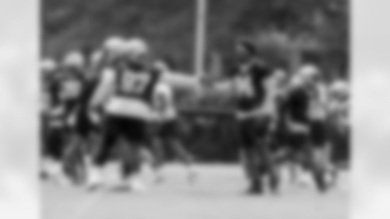 New Orleans Saints defensive lineman Malcolm Roach daps up defensive end Cameron Jordan during the team's 2022 OTA practices on June 9, 2022 at the Ochsner Sports Performance Center.