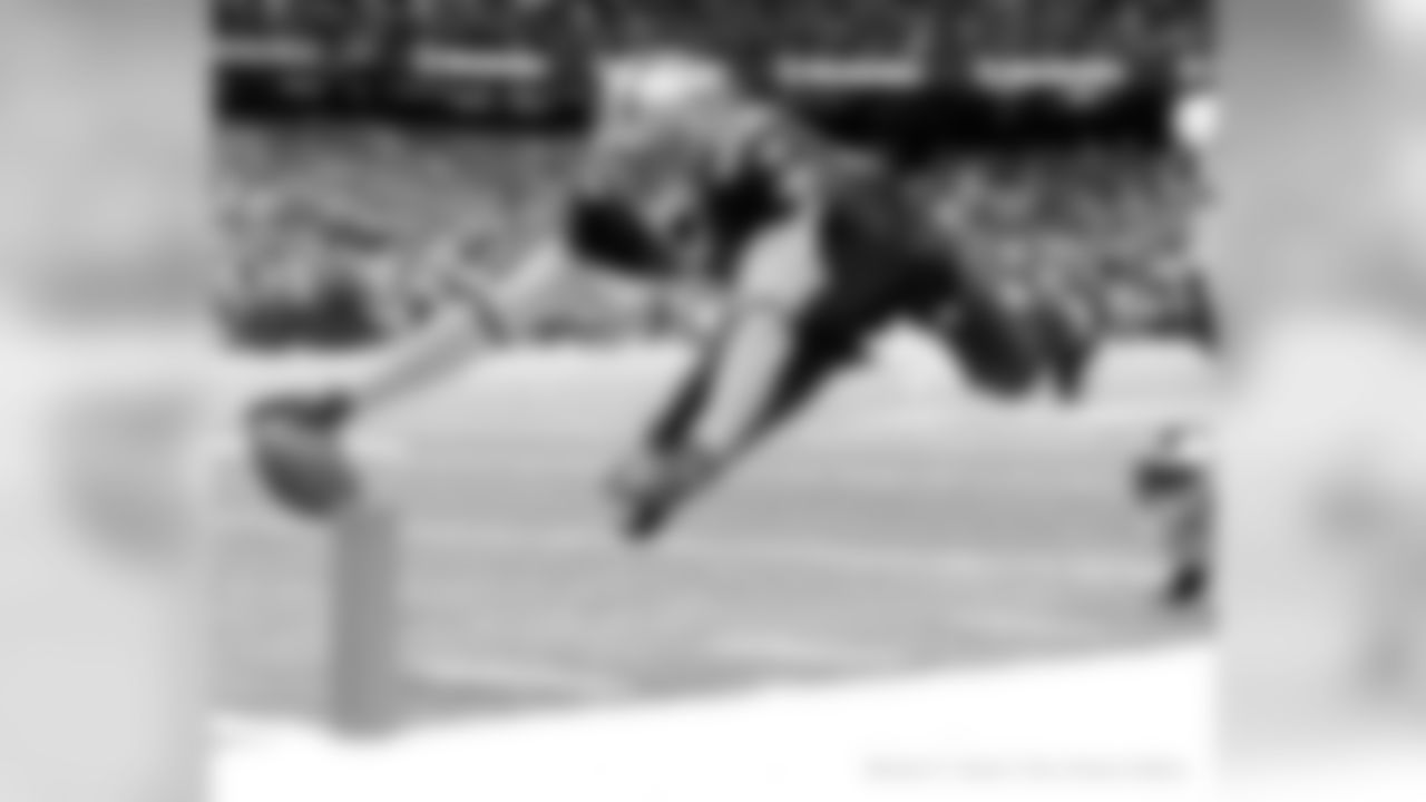 Tight end Jimmy Graham's love of flying comes shining through in this photo of him diving for the end zone.