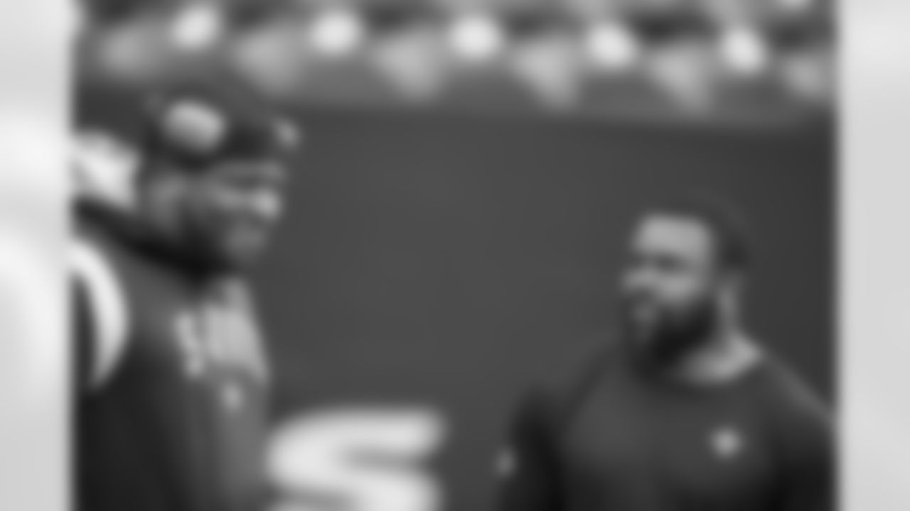 New Orleans Saints offensive lineman Cesar Ruiz and running back Mark Ingram warm up ahead of their 2022 Preseason Week 1 game against the Houston Texans.