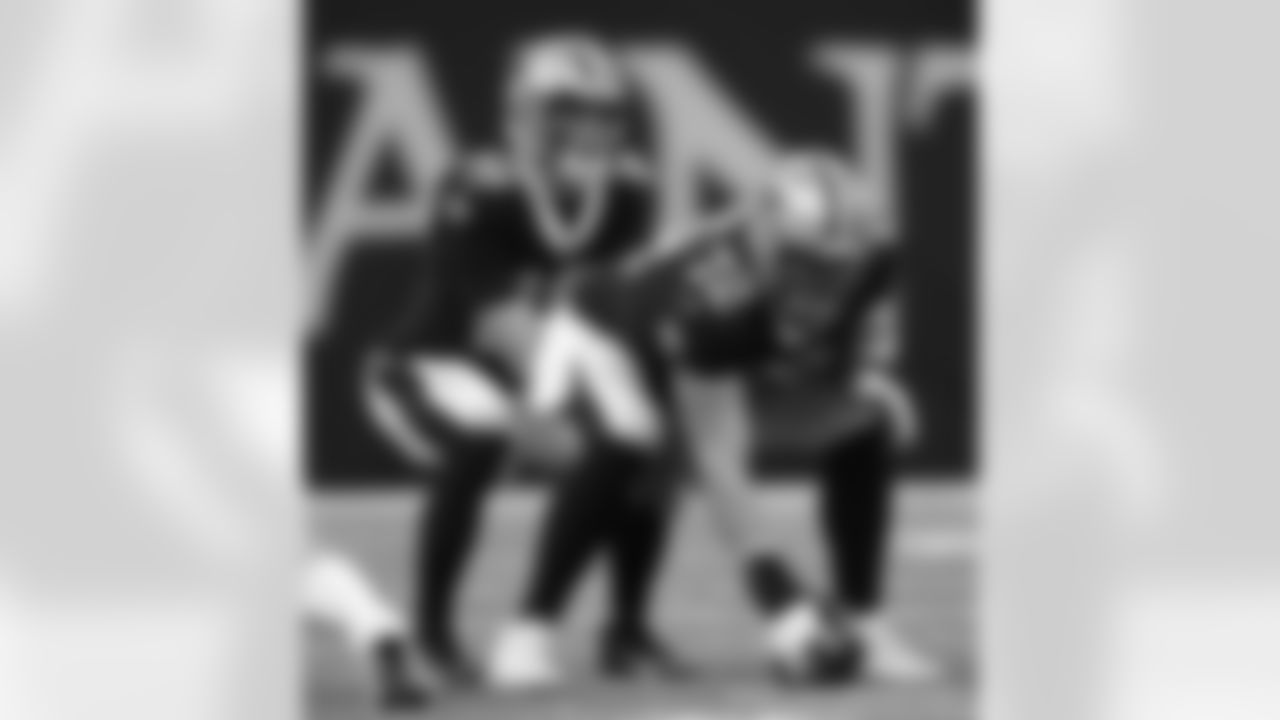 New Orleans Saints quarterback Ian Book (16) and center Nick Martin (72) in action during their 2022 Preseason Week 3 game against the Los Angeles Chargers.
