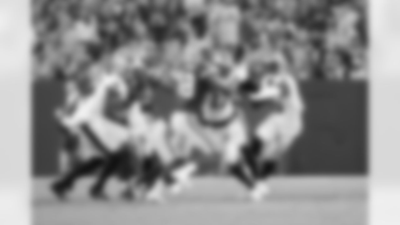 New Orleans Saints players in action during their 2022 Preseason Week 2 game against the Green Bay Packers.