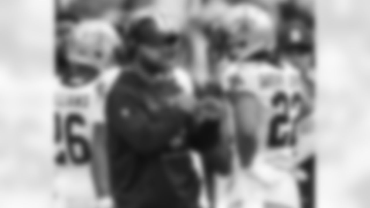 Coaches and staff of the New Orleans Saints take in Week 5 from the sidelines against the Washington Football Team on October 10, 2021.