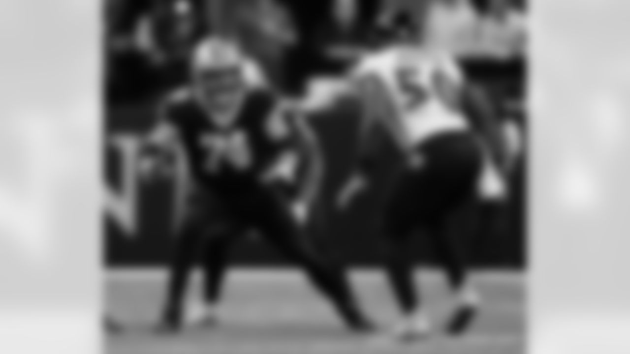 New Orleans Saints players in action during their 2022 Week 9 game against the Baltimore Ravens.