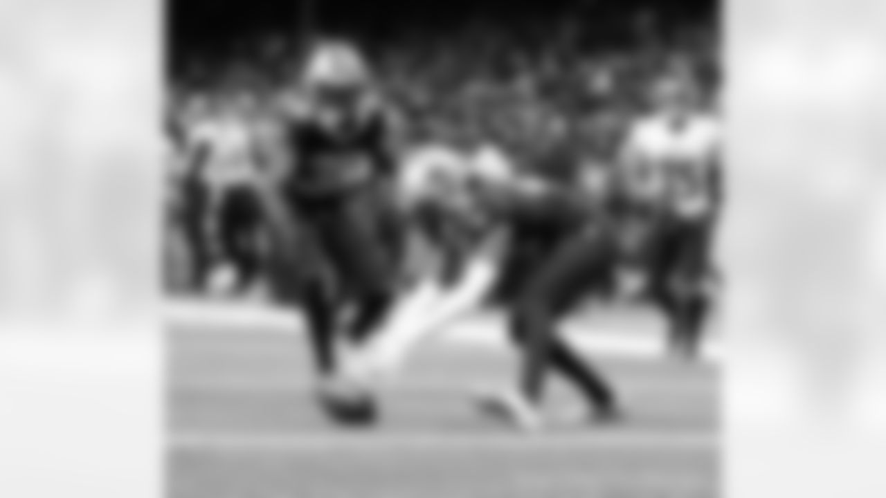 New Orleans Saints players in action during their 2022 Week 15 game against the Atlanta Falcons.