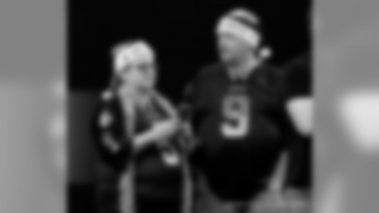 New Orleans Saints fans cheer on the team against the San Francisco 49ers at the Mercedes-Benz Superdome.