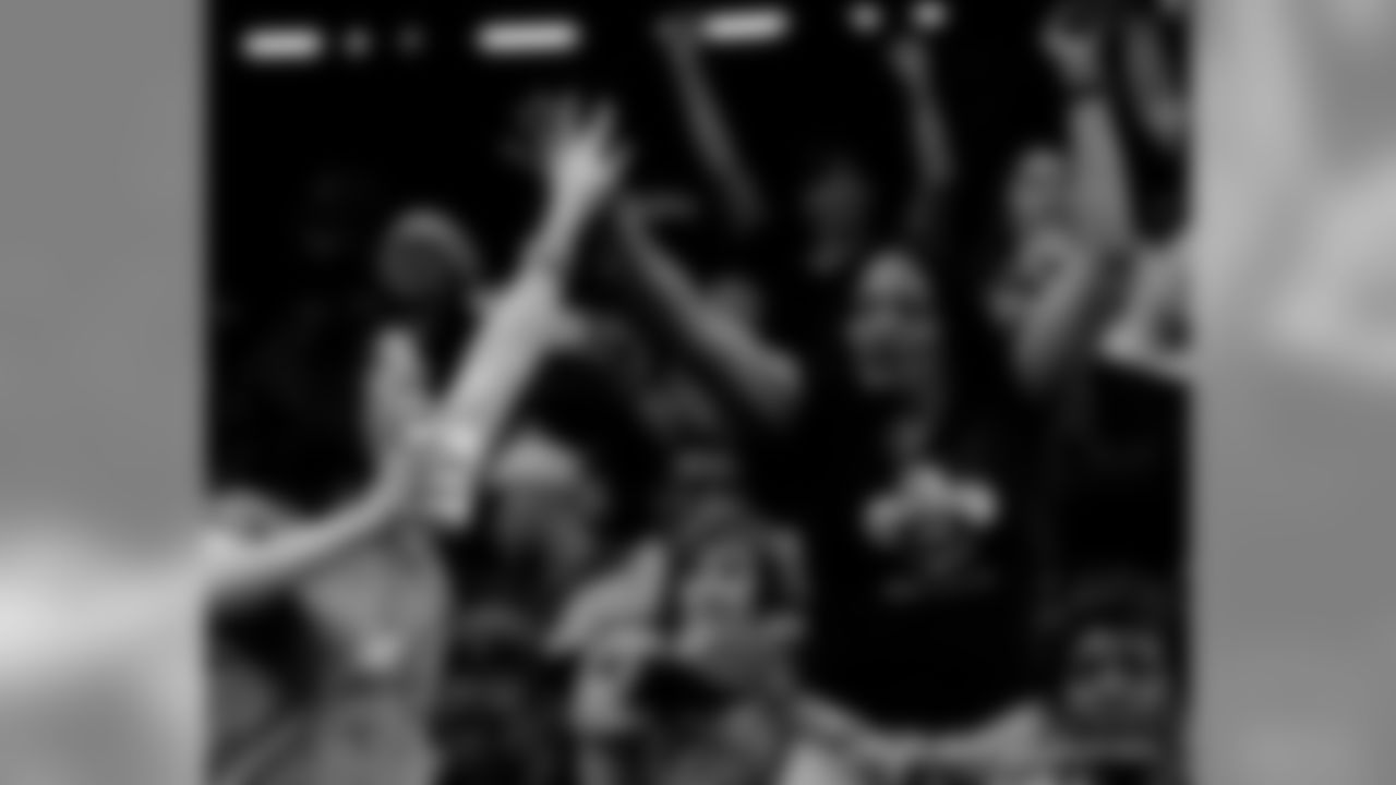 New Orleans Saints fans cheer on the team against the San Francisco 49ers at the Mercedes-Benz Superdome.