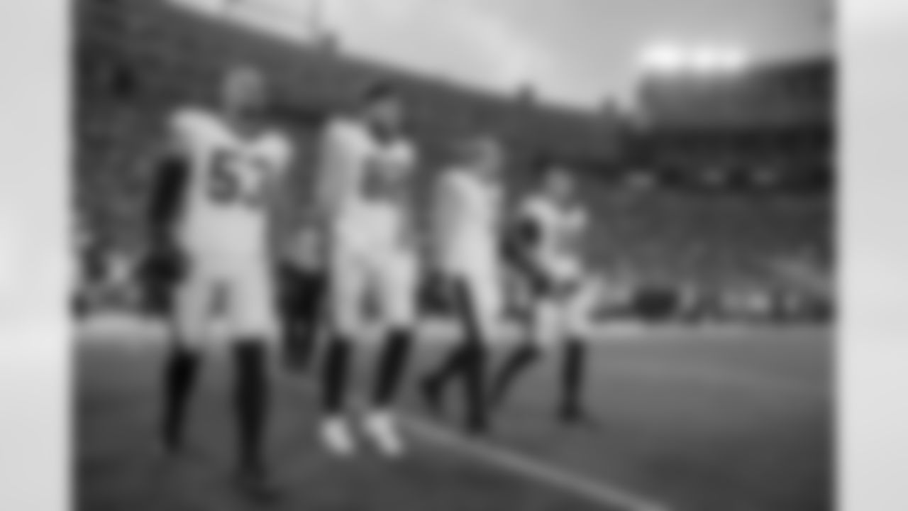 New Orleans Saints players in action during their 2022 Preseason Week 2 game against the Green Bay Packers.