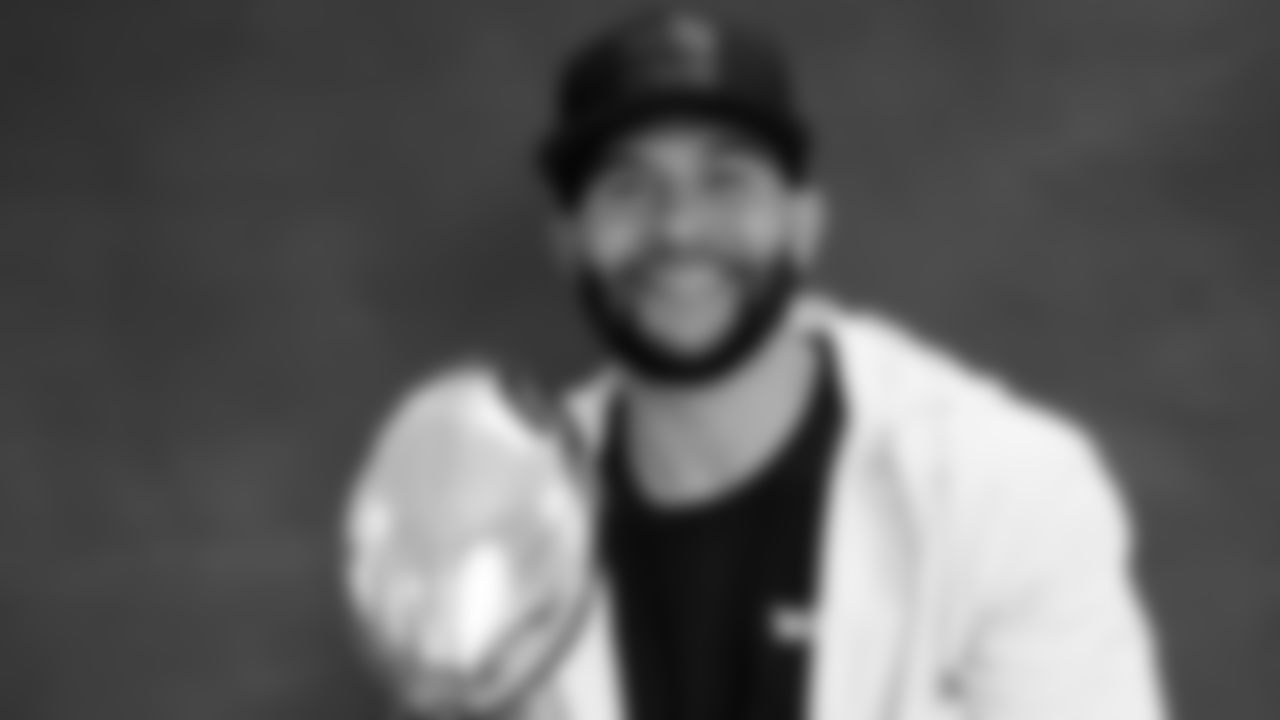 New Orleans Saints wide receiver Lance Moore poses with the XLIV Super Bowl trophy in 2019.
