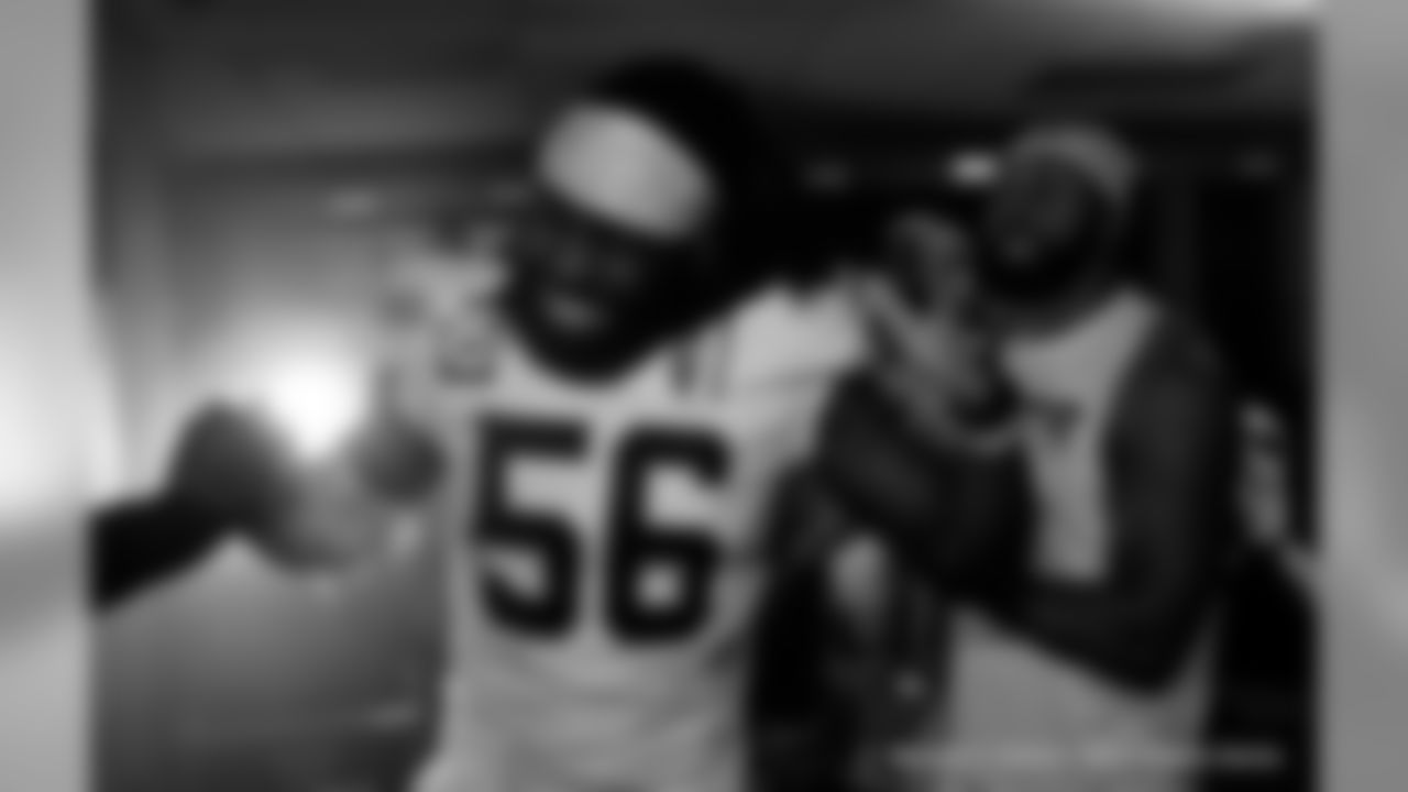 The New Orleans Saints celebrate their Week 16 win over the Tennessee Titans inside the locker room presented by Mercedes-Benz.