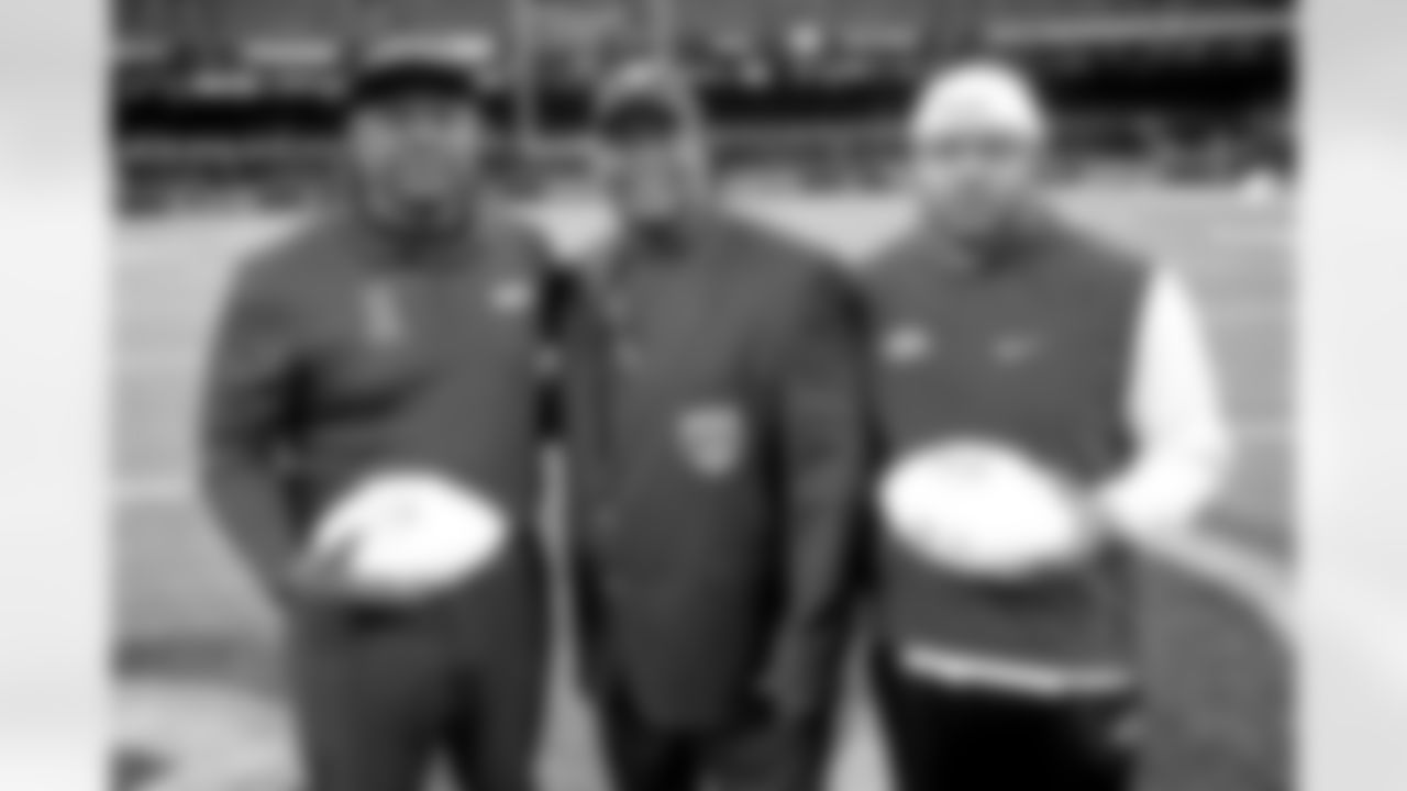 Saints legend Tyrone Hughes presented game balls to Westgate Tigers head coach Ryan Antoine and Warren Easton Fighting Eagles head coach Jerry Phillips before the Class 4A State Championship game on Friday, December 10, 2021. Hughes and Saints staff also presented game balls during Saturday's championship games at the Caesar's Superdome.