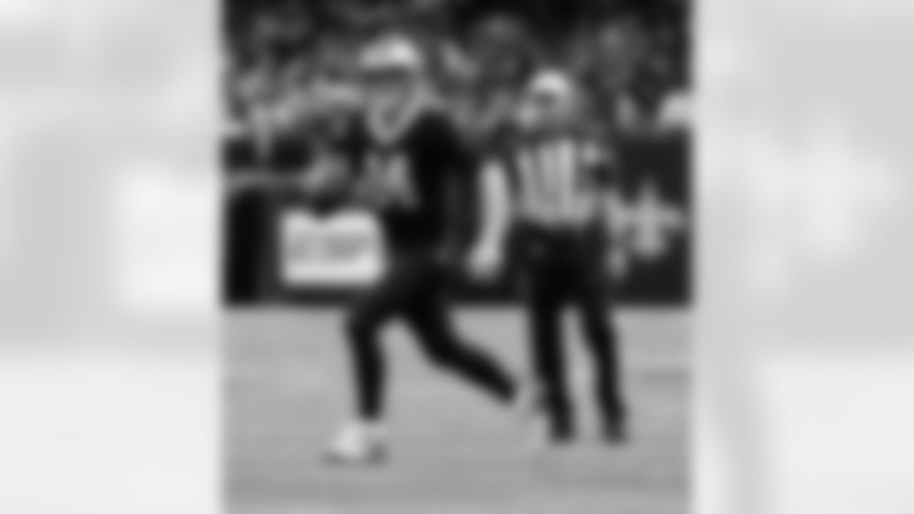 New Orleans Saints players in action during their 2022 Week 9 game against the Baltimore Ravens.