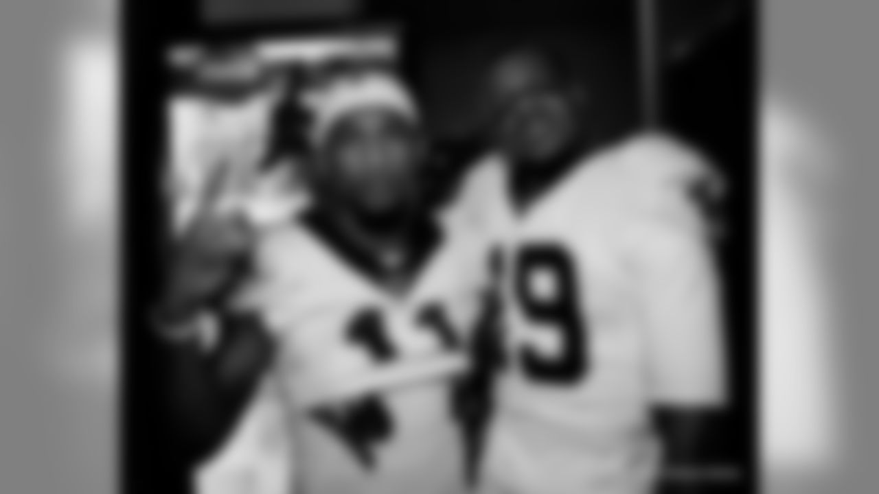 The New Orleans Saints celebrate their Week 16 win over the Tennessee Titans inside the locker room presented by Mercedes-Benz.