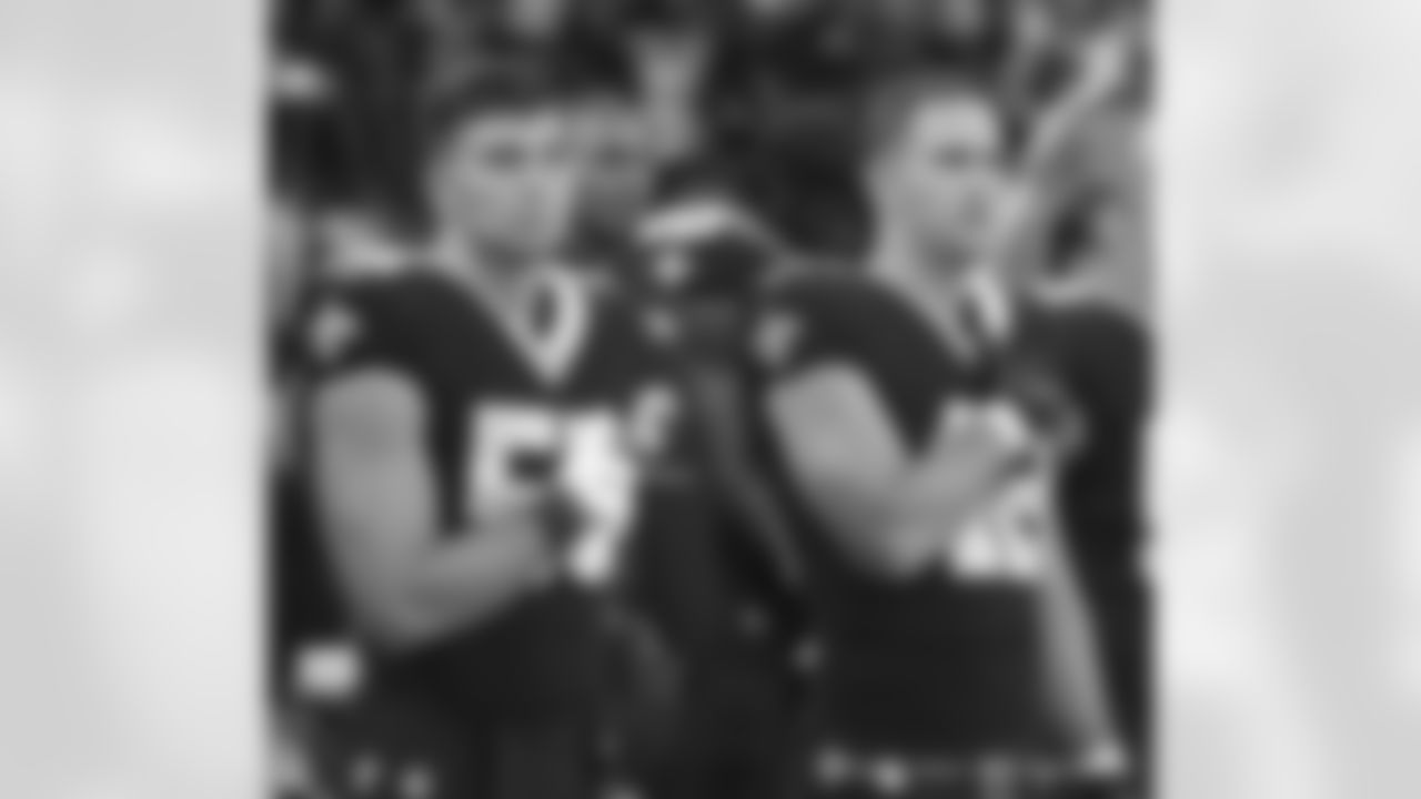 New Orleans Saints linebackers Kaden Elliss (55) and Chase Hansen (42) warm up ahead of their 2022 Week 2 game against the Tampa Bay Buccaneers.