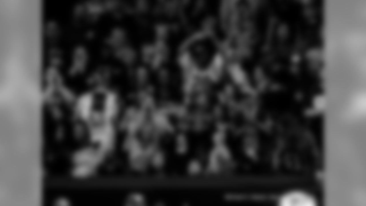 New Orleans Saints fans cheer on the team against the San Francisco 49ers at the Mercedes-Benz Superdome.